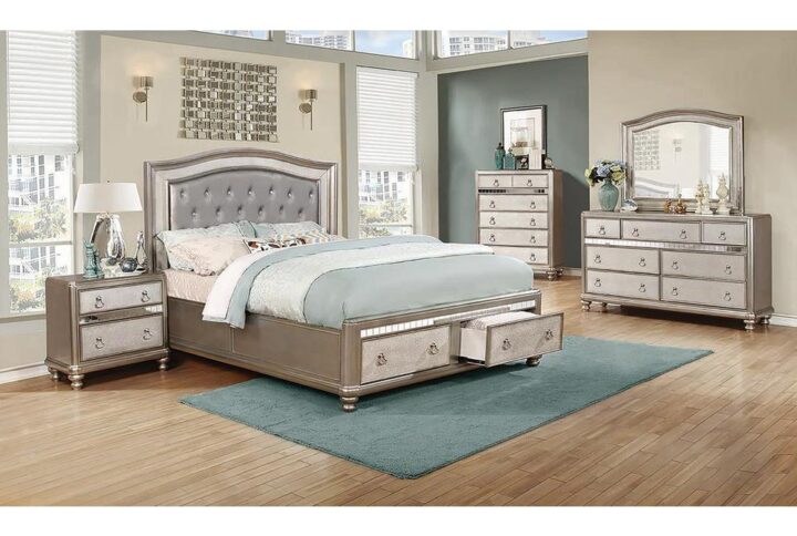 Give any bedroom an elegant vibe with this stunning four-piece set. Its camel back shaped headboard and mirror pull a room together in style. Felt-lined top drawers and a hidden jewelry drawer in the dresser offer added softness and security. A handy USB charger in the nightstand is a convenient and versatile touch. With a metallic finish enhanced by shimmering highlight glaze