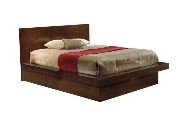The Jessica collection is highlighted by this eastern king bed that's perfect for a master bedroom. It is crafted from solid wood and ash veneers for style and durability. Wide base for mattress hangs over the solid floor base for a split level appearance. Finished in cappuccino with an option for white