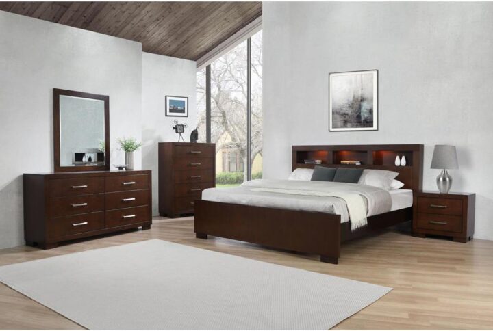 Add style and practicality to the bedroom with this 5-piece bedroom set from the Jessica collection. The storage bed has headboard with built-in bookcase and romantic lighting in each open shelf for books and a clock within arm's reach. The nightstand and tall chest include deep drawers with lustrous