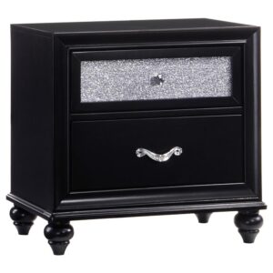 Create an aura of dark glam with this modern two-drawer nightstand. The classic silhouette features metallic acrylic drawer fronts that dazzle. Sleeken up a chic bedroom with the bold black finish. Facetted crystal hardware creates a stark contract against the deep hues while creating visual pops of intrigue. The tapered legs feature beautifully rounded curves.