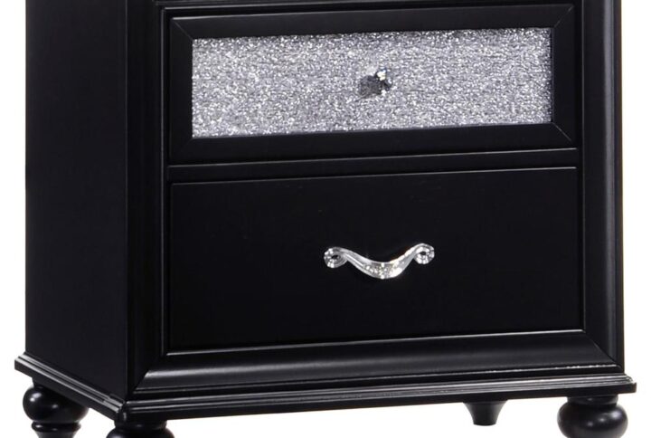 Create an aura of dark glam with this modern two-drawer nightstand. The classic silhouette features metallic acrylic drawer fronts that dazzle. Sleeken up a chic bedroom with the bold black finish. Facetted crystal hardware creates a stark contract against the deep hues while creating visual pops of intrigue. The tapered legs feature beautifully rounded curves.