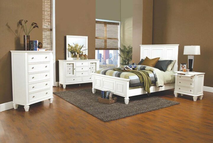 The Sandy Beach collection features this California king bed that's just as suitable for a downtown loft as it is for a beachfront home. Headboard and footboard feature detailed carvings and moldings. High headboard and low footboard convey a stately appearance. Crafted from maple veneers in a chic cream white finish. Also available in rich cappuccino or resplendent black.