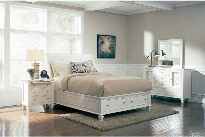 A highlight of the Sandy Beach collection is this eastern king storage bed that can be showcased in any primary suite. Headboard is flared and features carved markings and moldings. Footboard houses two storage drawers that are as practical as they are decorative. Bed is constructed from tropical hardwoods and veneer for dependability and durability. Classy cream white finish but also available in black and cappuccino.