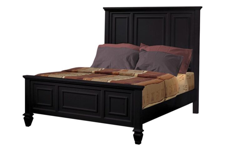 This stately Sandy Beach eastern king bed is suitable for a city penthouse or suburban townhome. Headboard and footboard are carved with detailed moldings and distinctive lines. The imposing headboard and low footboard impart a dignified character. Crafted from tropical hardwoods in a black finish. Also offered in buttermilk.