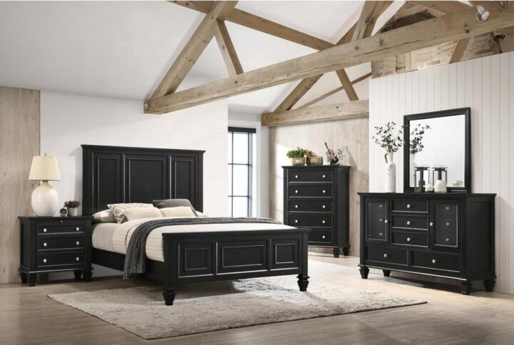 The Sandy Beach collection presents this splendid 4-piece bedroom set that offers a style that's both timeless and distinctive. The bed has a headboard and footboard that both feature exquisitely carved paneling. The nightstand has three drawers and a pull-out service tray for added convenience. The dresser features an array of different sized drawers and two doors that open up for access to the smaller drawers as well as room on top for the accompanying square mirror. Each piece is constructed from maple veneers in a brilliant black finish (also available in a timeless buttermilk finish).