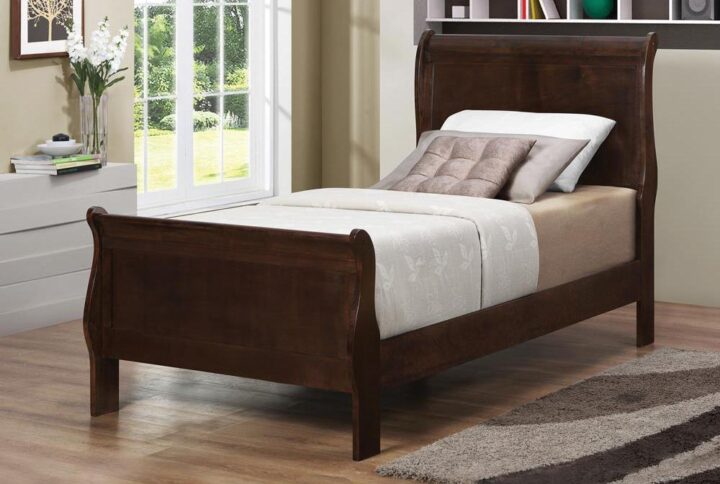 Update the classic style of a guest room or child's room with this stylish twin sleigh bed. Elegantly designed with a curved headboard and footboard