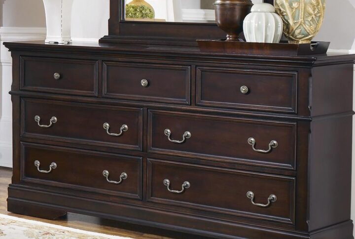 Stunning European-inspired design is celebrated in this traditional seven-drawer dresser. Crafted with clean lines and beveled edges