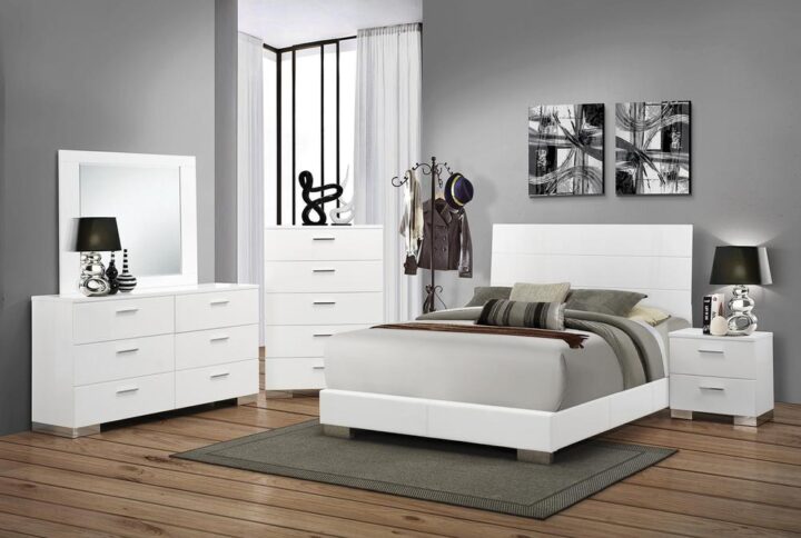 This gorgeous 5-piece bedroom set from the Felicity collection has the exquisite styling and modern appeal for any contemporary master bedroom. The clean bed is crisply crafted with a low footboard and contrasting high headboard that features illuminating blue LED touch lighting to brighten up the bedroom. The matching nightstand
