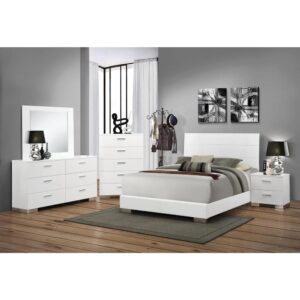 This gorgeous 5-piece bedroom set from the Felicity collection has the exquisite styling and modern appeal for any contemporary master bedroom. The clean bed is crisply crafted with a low footboard and contrasting high headboard that features illuminating blue LED touch lighting to brighten up the bedroom. The matching nightstand