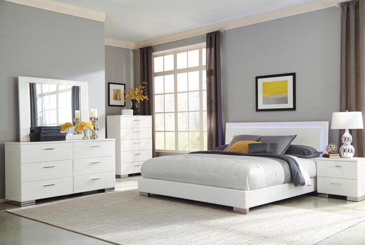 This contemporary bedroom set is sure to dazzle and delight every time you set your eyes on it. A single panel bed with a Louis Philippe style headboard contains built-in LED light for incredible illumination. Bold block style legs with a chrome finish offer support for each piece in this bedroom set. Enjoy the style and function of every item