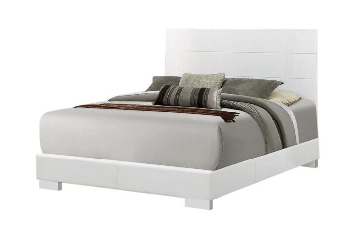 Balance and symmetry are in full style. This elegant bed stands out to capture attention. With an extra tall headboard and low-profile