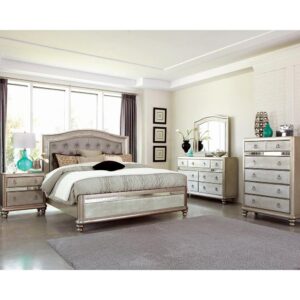 This beautiful five-piece bedroom set exudes luxurious glamour and convenient functionality. Its exquisite design will amplify your decor with an air of modern opulence. This set is brought to life by a shimmering metallic finish
