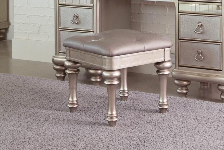 Pull this backless stool up to a vanity table for a comfortable place to sit as you primp for a night out on the town. Its metallic finish and highlight glaze create a glamorous effect. The backless and armless design allows for easy freedom of movement as you reach for your cosmetics or perfume. Sleek