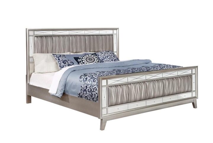 The Leighton collection presents this magnificent glam-style bed. It has an upgraded metallic finish that evokes images of sparkling mercury. The etched mirror-paneled accented frameworks features real mirrors for a mesmerizing effect. Wrapped in metallic leatherette with scintillating wave patterns. This bed is an absolute delight for the bedroom.