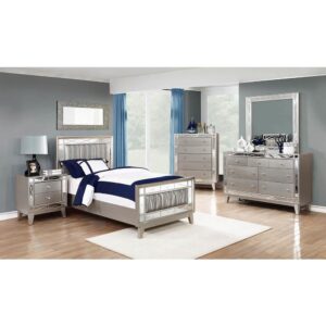 The Leighton collection presents this magnificent glam-style bed. It has an upgraded metallic finish that evokes images of sparkling mercury. The etched mirror-paneled accented frameworks features real mirrors for a mesmerizing effect. Wrapped in metallic leatherette with scintillating wave patterns. This bed is an absolute delight for the bedroom.