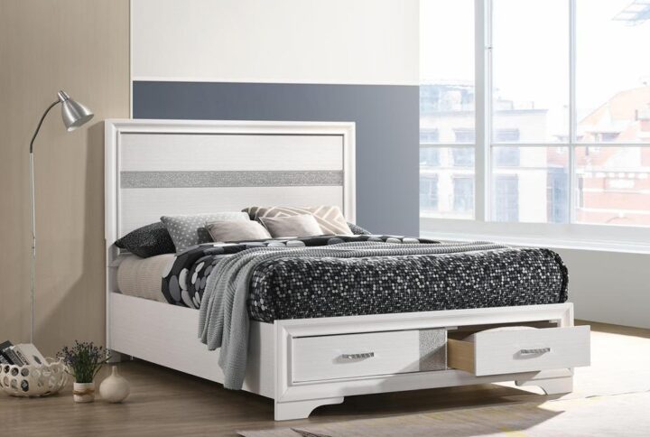 Give your bedroom a glamorous update with this gorgeous storage bed. The headboard and footboard are decorated with acrylic glitter panels for a dazzling touch of shine. Two slide-out drawers are built into the footboard to maximize storage space. The drawers are topped with rhinestone handles for even more beautiful bling. This platform bed is mattress ready for added convenience.