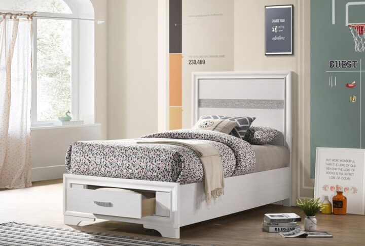 Give your bedroom a glamorous update with this gorgeous storage bed. The headboard and footboard are decorated with acrylic glitter panels for a dazzling touch of shine. Two slide-out drawers are built into the footboard to maximize storage space. The drawers are topped with rhinestone handles for even more beautiful bling. This platform bed is mattress ready for added convenience.