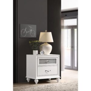 white nightstand is embellished with touches of sparkle to add a pop of pizzazz to any bedroom. The faceted crystal hardware glistens and gleams. The glittery acrylic panels sparkle and shine against the clean