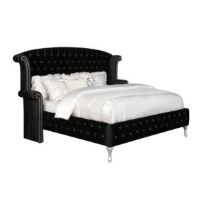 This luxurious four-piece master bedroom set is built with a brilliant metallic finish and elegant black button tufted fabric. The stylish and impressive eastern king bed will turn heads with a nailhead trim that accentuates the rolled headboard and armrests. The meticulously crafted dresser features abundant storage with an assortment of spacious drawers. The night stand has two deep drawers and a table top designed to accommodate a table lamp and a decorative vase. The included dresser mirror is constructed with a slightly curved top that adds a bit of style to complete the look.