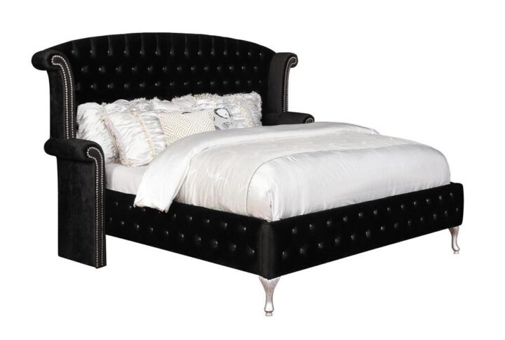 This entire opulent five-piece master bedroom set comes in a brilliant metallic finish with sumptuous black button tufted fabric. The stately eastern king bed has contrasting