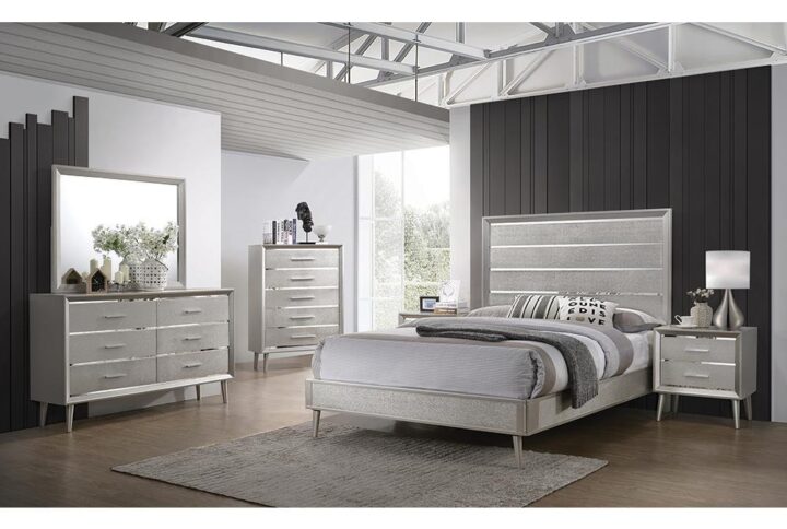 Dazzle up your bedroom decor with mid-century modern glamour. This elegant silver bed frame lends elegance and style to any space. A metallic sterling finish adds shimmering sparkle to its sleek silhouette. Gleaming lines of shining
