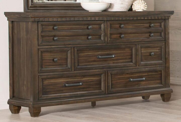This classic farmhouse-traditional style dresser is a boost for bedrooms in need of storage space and aesthetics. Rich in finish with an Acacia wood stain