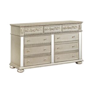 Add luxurious style to your bedroom with this glam dresser. This nine drawer dresser displays a metallic platinum finish for a luxurious touch. The mirrored panels provide added visual punch in this luxe dresser. Three slim top drawers are anchored by six additional larger drawers for ample organizing space. Traditional wood carved details on the top drawer fronts provide additional visual interest for an overall glamorous look.