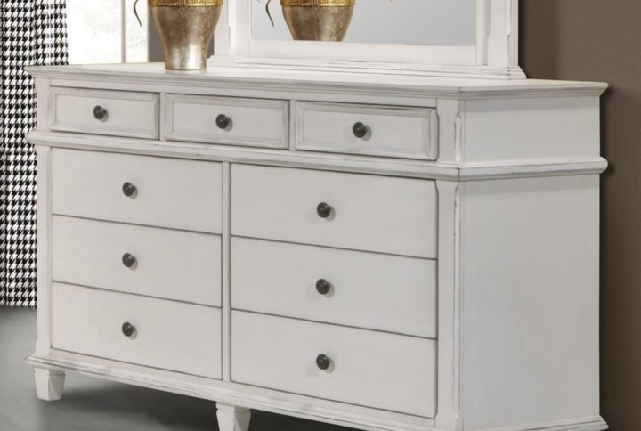 Tuck away all your clothing and accessories neatly in this transitional dresser from the Carolina collection. The clean