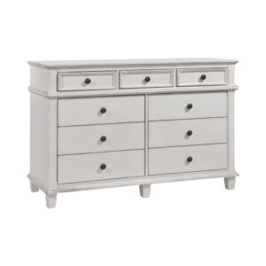 transitional lines are enhanced by subtle wood trim details throughout the piece. An antique white finish offers a welcoming cottage feel with striking dark finished drawer knobs. Three slim top drawers are perfect for sorting all your delicate items and accessories
