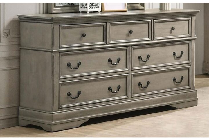 Charming European elements merge with modern farmhouse accents to create this lovely seven-drawer dresser from the Manchester collection. Featuring a wheat finish with gray undertones