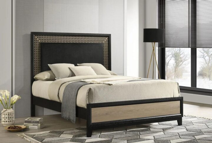 Look for artistry in a fashionable bed that turns your boudoir into a fabulous place of style and relaxation. This glam-inspired bed pulls out all the artisan stops with a touch of Art Deco style modernized to fit today’s style needs. Its extra-tall headboard features construction of wood and wood products with a decadent cutout border trim embellishment. A black finish headboard and side rails complement a soft light brown natural wood-look footboard inset. The striking design scheme of this sleek bed begins an entire transformation of a master or guest suite.