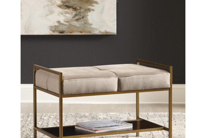Sink into the plush cushions from this modern gold bench. Ideal in any space