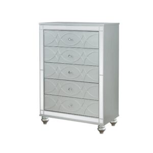 Enhance your home with a modern glam update to a classic design with this transitional five-drawer chest. It boasts a dazzling design that takes lends glitz to any modern bedroom. It comes in a vibrant silver metallic finish with fret work detail on the front panels and drawer fronts. The drawers are adorned with crystal-like pulls and the top ones are lined with black felt to protect treasured valuables. Delicate bun feet complete the design of this exquisite masterpiece.