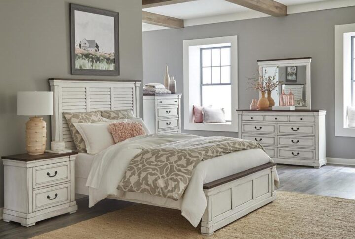 Achieve your dream of a country chic bedroom suite with this four-piece set. A lovely panel bed with a shutter-style headboard is the main attraction while the footboard is crafted with a solid panel design. Crown molding enhances all pieces