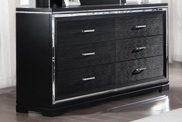 Contrasted colors showcase the luxe look of this glam six-drawer dresser. With sparkling accents like slim diamond-encrusted pulls and a polished mirror trim that defines the silhouette