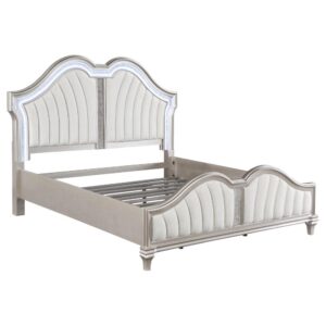 glam platform bed. A curvy double arch headboard and footboard are designed with a padded insert of flared channel tufting that lends an eye-catching motif. Each padded piece is upholstered in a soft