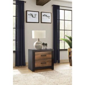 Don't be surprised if you instantly fall for this transitional two-drawer nightstand with a rustic two-tone twist. It casts a warm aura that evokes Nature with reclaimed wood materials construction. The nightstand comes in a deep licorice finish that soothes the senses. Each drawer features a caramel finish with wood grain details and is adorned with a richly hued dark bronze metal pull handle. Solid legs and sides give it optimal stability and durability.