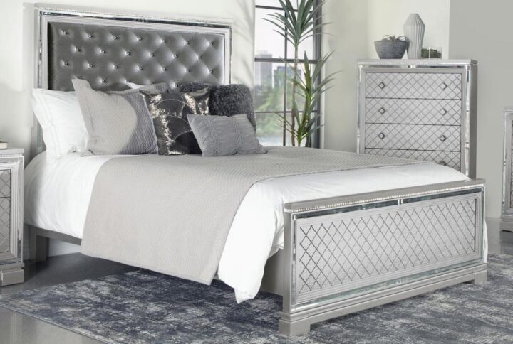 Vibrating radiance and elegance is this glamorous bed from the Eleanor bedroom collection. With stunning features like reflective mirror trim accents and a button-tufted padded headboard with sparkling crystal-like buttons set in a silver velvet fabric