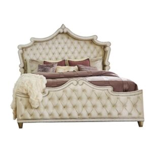 inspired by wingback headboard designs. Both the head and footboard are adorned with dual rows of chrome nailhead trim. Incredible button tufting on this bed is enhanced with faux crystal buttons. Inspired by French Provincial decor