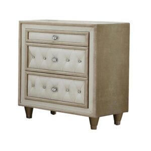 this upholstered nightstand has everything you need for an elegant bedroom. It's a three-drawer nightstand that offers storage space for small bedside essentials. Beautiful button tufting on the drawers is enhanced with crystal-like buttons. Tapered legs add yet another elegant touch to this ivory and camel nightstand. Place it by your bed and watch your sleeping space instantly transform.