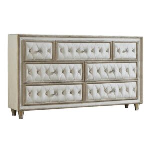 it's the perfect blend of traditional and modern. Seven spacious dressers are equipped for storing garments and clothing. Each dresser drawer is upholstered with soft fabric and button tufting. Crystal-like accents serve as buttons and drawer knobs and this piece is supported on tapered legs