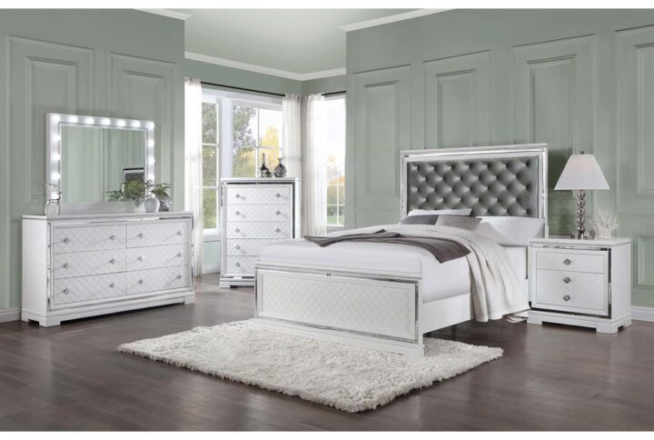 Understated elegance and luxe accents combine to create this glam five-piece bedroom set. Topped off with inlaid mirror trim tile borders