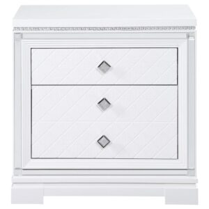 Clean lines and luxe details shine through in this two-drawer nightstand from the Eleanor bedroom set. Sparkling accents like a reflective mirror trim outlining the set of drawers and square knobs encrusted with diamond-like accents create a regal display against a bed. This glam nightstand opens itself up to whatever color palette you prefer and offers hidden extras like USB charging ports and a felt-lined top drawer for delicate accessories and jewelry. Lending to the understated white finish is textured drawer fronts embossed in a wild crocodile and diamond pattern. Along the top just below the tabletop surface is a slim crystal-like molding that completes the piece and mirrors the hardware.