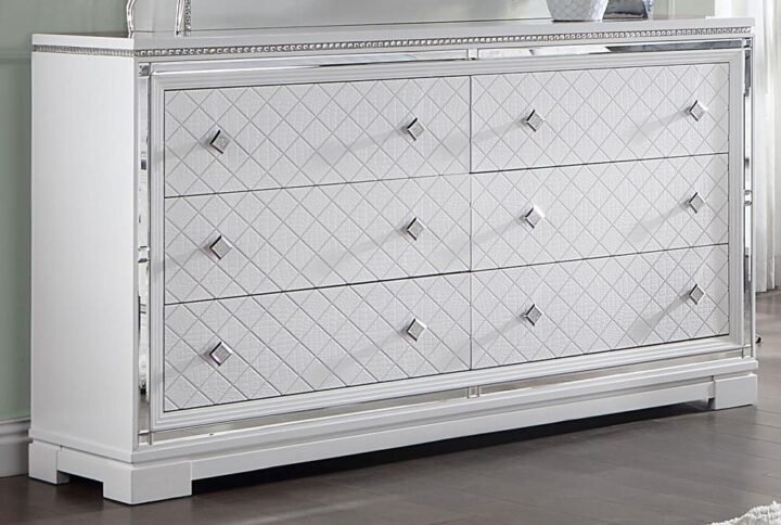 This glam six-drawer dresser lends a stunning addition to a modern bedroom retreat. A bright finish lends itself to existing color palettes while accents like diamond-shaped