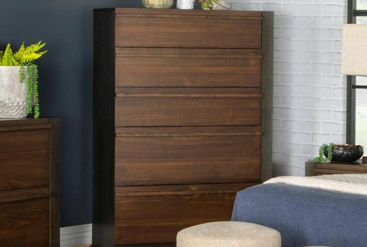 Complete a bedroom ensemble with this elegantly simple modern tall wood chest. Made of hardwoods and veneers