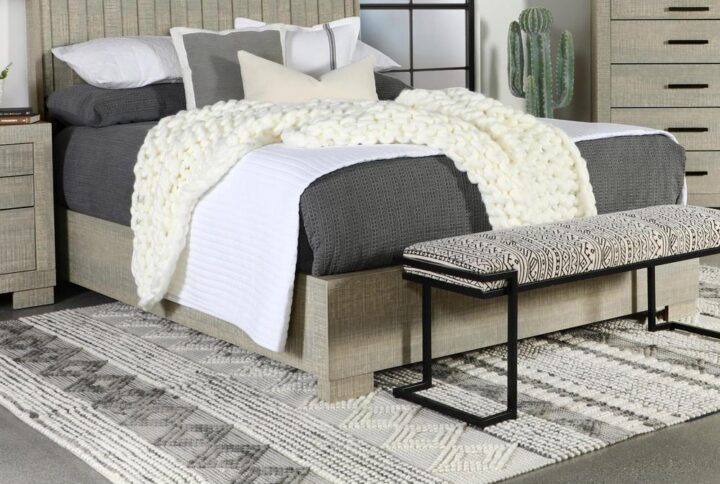 Turn a conventional bedroom into a relaxing transitional haven with this elegant bed. Choose its neutral rough sawn gray oak finish to retain versatility while updating any master or guest suite with an anchor piece designed to inspire. Contemporary rustic vibes shape a bed with an extra high headboard featuring vertical slats and wrap-around rails and footboard. This tasteful bed serves as a partner to matching or coordinating case pieces and accessories. Constructed of Asian hardwood
