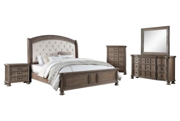 A transitional bedroom with traditional design featuring an arched headboard that is buttontufted as the centerpiece. Finished drawer boxes include brown felt-lined top drawers. The nightstand's top drawer has cord access for personal electronic charging. The wire-brushed surface has a beautiful vintage finish with faux wood carved columns and details.