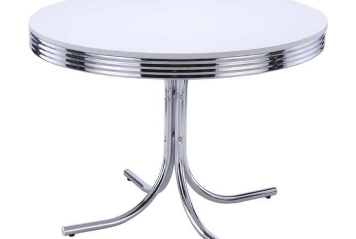 Travel back in time to an easy era where soda shoppes served as social centers. This five-piece dining set features a classic round dining table with a metal ellipse edge profile and shiny top. A decadent flared metal base is open and airy