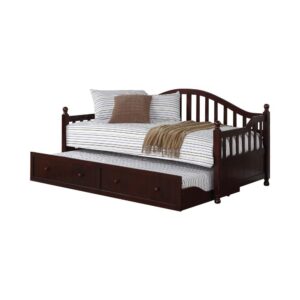 Add a dynamic enhancement to a teen's or child's room. Extra sleeping quarters in a guest room is also a benefit of this day bed with trundle. A stylish slatted design with a curved silhouette delivers an eye-catching enhancement. Deep cappuccino brings a finish that is both commanding and versatile. Solid pine construction with wood knobs and a convenient trundle highlight the features of this fabulous bed.
