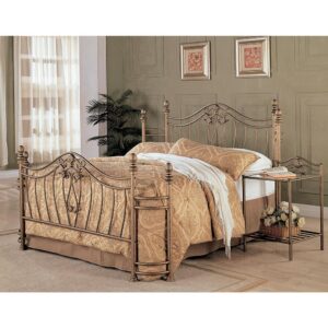 This Sydney metal bed has an elegance fit for a classic-style home. It features elegant headboard and footboard with curved crowns and swirling floral motifs. The wraparound look on both ends adds a traditional touch. It's finished in warm antique brushed gold that conveys class and charm. This metal bed has a timeless design that blends well with different decor and furnishing tastes.